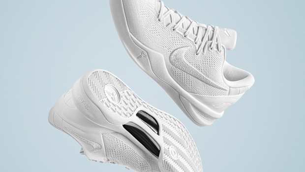 Side view of Kobe Bryant's white Nike basketball shoes.